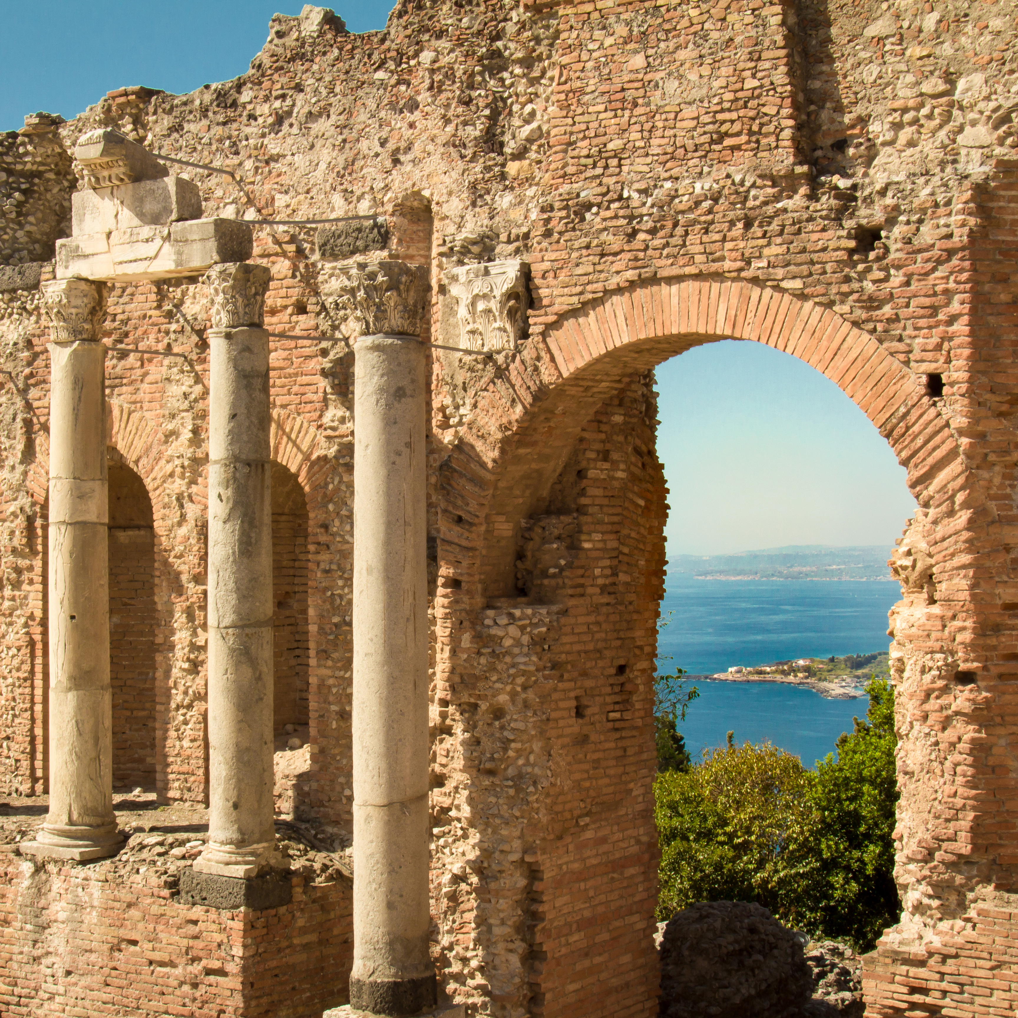Ionian Sea through the arches of the Greek theater in Taormina, Sicily